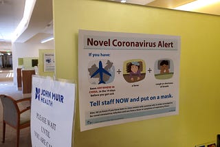 Warning sign with text reading “Novel Coronavirus Alert”, referring to quarantine and screening procedures.