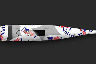 A plastic oral thermometer covered with “I voted” stickers.