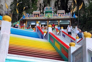 Painted steps lead to the ornate entrance to the caves