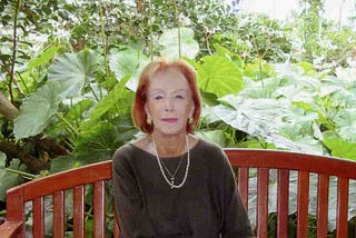 picture of my 90 year-old mother sitting on a bench smoking a cigarette