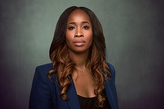 Headshot of Annie Jean-Baptiste in a blue blazer