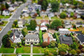 A diorama of a neighborhood with model homes