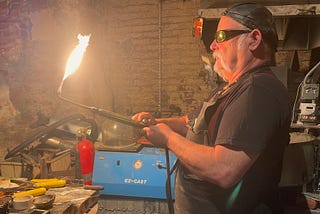 Dan Macchiarini fires up a blow torch in his North Beach metalworks shop Macchiarini Creative Design. He is a longtime proponent of a commercial vacancy tax.