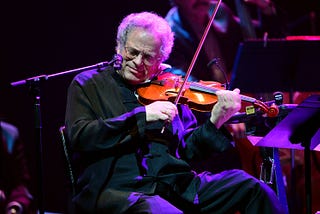 Itzhak Perlman performs at the Barclays Center on February 28, 2013 in New York City.