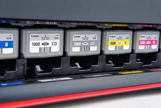 Canon ink cartridges in a printer.