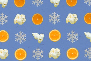 A background type pattern design consisting of orange slices, popcorn, and snowflakes on a blue background