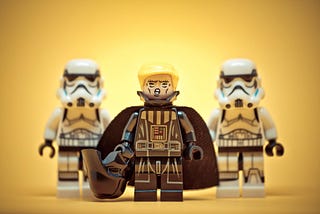 Flanked by Star Wars action figure stormtroopers, Trump appears in the character of Darth Vader.