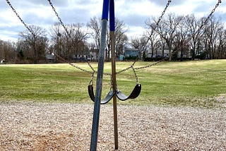 Two swings tangled together.