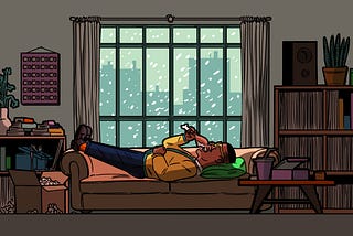 A Black person, lying on a couch in front of a window showing a snowy cityscape, eating a chicken drumstick.