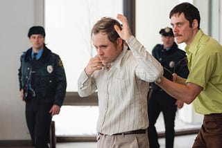 Dacre Montgomery and Bill Skarsgård in Dead Man’s Wire | Credit: Row K Entertainment