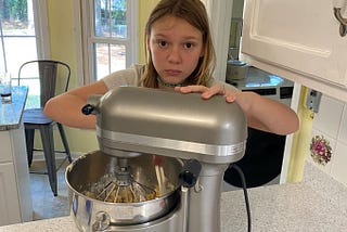 Kid uses stand mixer