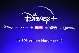 A screen announcing the Disney+ streaming service is seen at the D23 Expo.