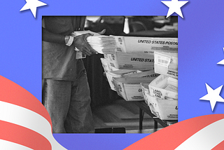 A poll worker collects mail-in ballots.