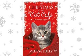 Cat peeking out of a sweater in a red Christmassy decor (source: Goodreads)