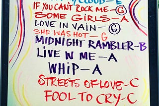 Colorful hand-written list upon a whiteboard of The Rolling Stones songs, including Fool To Cry, from part of their 2016 London exhibit Exhibitionism