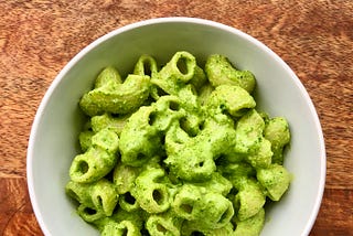 Scroll on to learn about the kale-almond pesto coating these lumache.