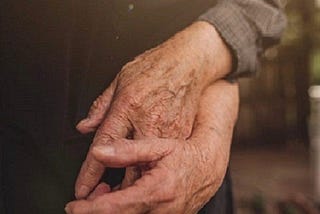 Picture of an old couple holding hands (just the hands).