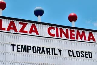 A marquee reading, “Plaza Cinema: Temporarily closed.”