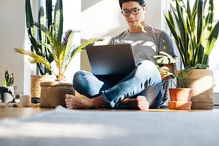 Asian man on his laptop.