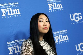 A photo of Awkwafina.