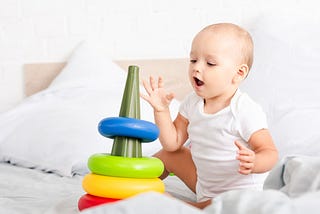 A baby playing with toys.