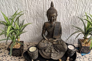 Meditating Buddha in a serene pose.