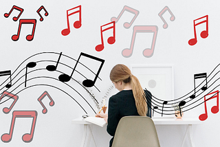 girl tries to write at a desk and all around her music notes are flying in the air.