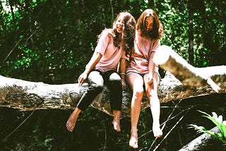 Two young girls in the woods