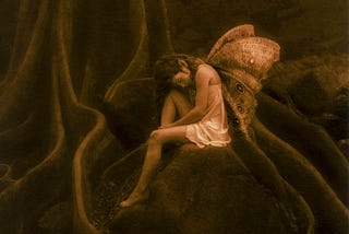 A sepia-toned image of a fairy sitting on a rock surrounded by tree roots