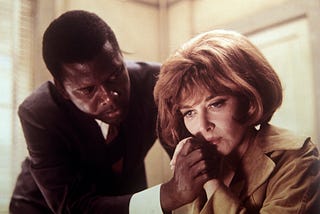 Sidney Poitier comforting a distraught Lee Grant in a scene of In the Heat of the Night