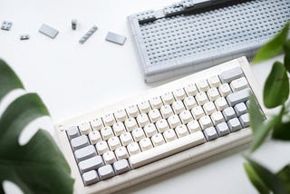 top down photo of the ADAM lego keyboard and the alternative grey case.
