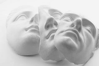A photo of three white face masks (the marble kind, not the skincare kind).