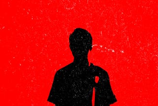 An illustration of a black silhouette of a young man against a bright red background.