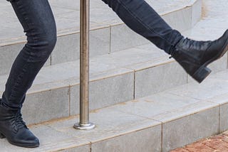 Feet slipping on stairs, possibly falling