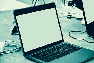 A bluish image of a blank Macbook computer screen.