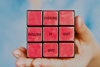 Rubik’s Cube with a note ‘Figure it out’