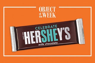 A Hershey’s chocolate bar with packaging designed specifically for International Women’s Day, with the letters “SHE” highlighted. Above the Hershey’s logo, there is the addition of the word “Celebrate,” so that in its whole it reads: “CELEBRATE HerSHEy’s.”
