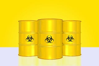 Three bright yellow barrels with toxic waste symbols in black