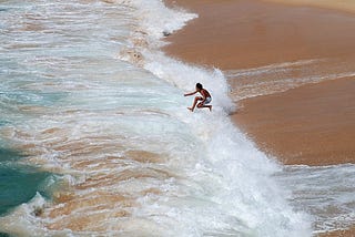 A man jumping into the sea