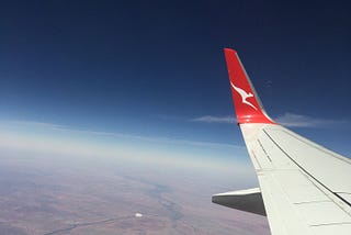 View from an airplanes window, ground below