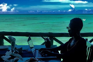 Photo of the author working on her laptop aloft the Indian Ocean.