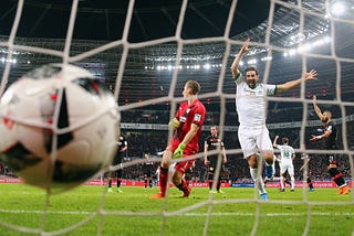 Claudio Pizarro of Bremen celebrates his team’s first goal during a soccer match in Leverkusen, Germany.