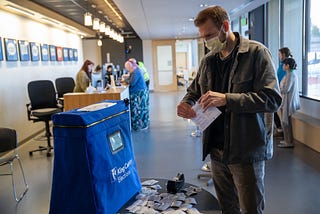 A voter casts his ballot during early voting at the King County Elections processing center on March 9, 2020 in Renton, WA.