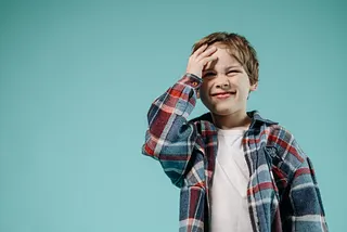 A boy smacking his head
