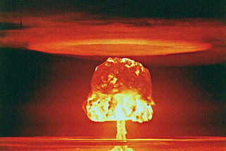 First thoughts after an explosion by nicole wallet. This is a picture of a red hot explosion, more than likely an atomic or hydrogen bomb.