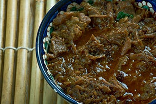 A bowl of Dinuguan, a Filipino stew made from pork and pig’s blood.