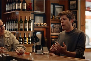 Jony Ive and Sam Altman discussing future AI devices in a bar
