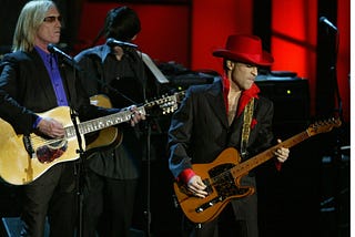 Prince performs along with Tom Petty at the 19th Annual Rock and Roll Hall of Fame Induction Ceremony in New York City, 2004.