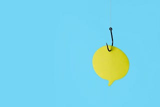 A yellow paper quote bubble on a fishing hook with a blue background.