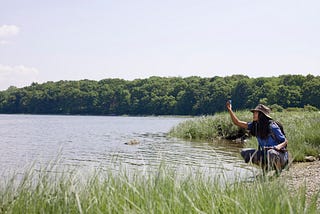 Environmentalist taking water sample